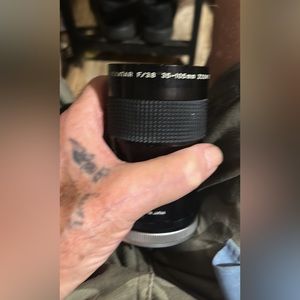 Two lenses one made by canon one made by prinz in box